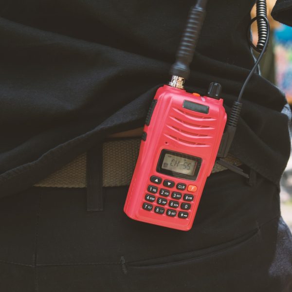 Red radio communication with security guard